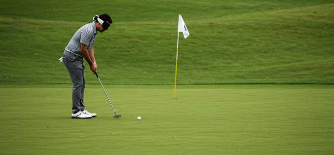 Blindfolded golfer putting