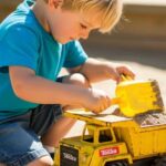 boy playing with a tonka truck