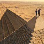 CEO vs President vs Chairman vs Owner: What’s the Difference? A president and the CEO standing on top of a pyramid.