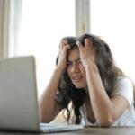 Frustrated Woman Looking at Website